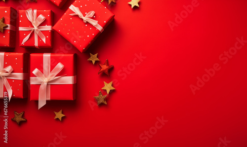 Gift boxes wrapped in red paper with white bow on red background with copyspace