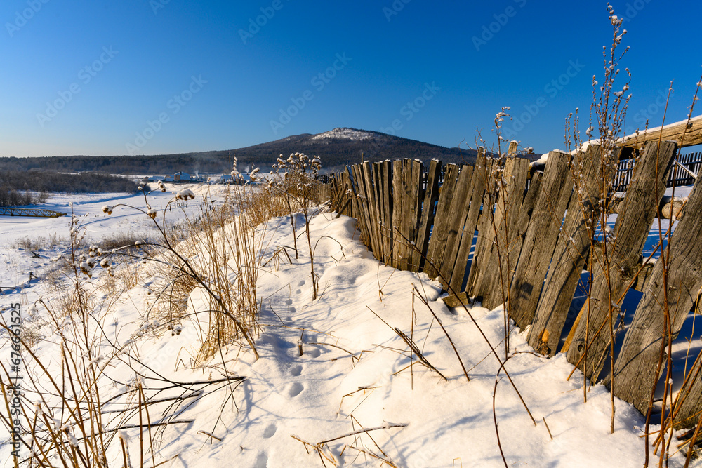 Winter snowy village in the Ural mountains. Winter snowy village in the Ural mountains.