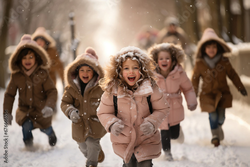A group of young children running down a snow covered street