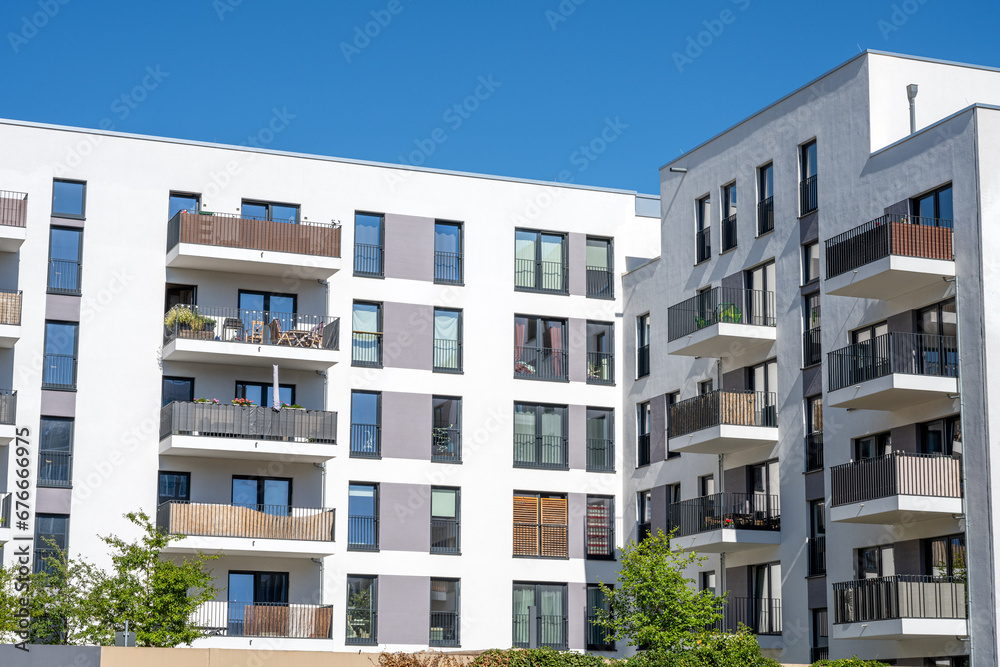 New white apartment building in front of a blue sky seen in Germany New white apartment building in front of a blue sky seen in Germany