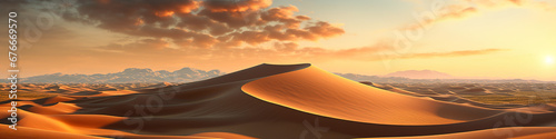 A desert landscape with sand dunes and mountains in the distance