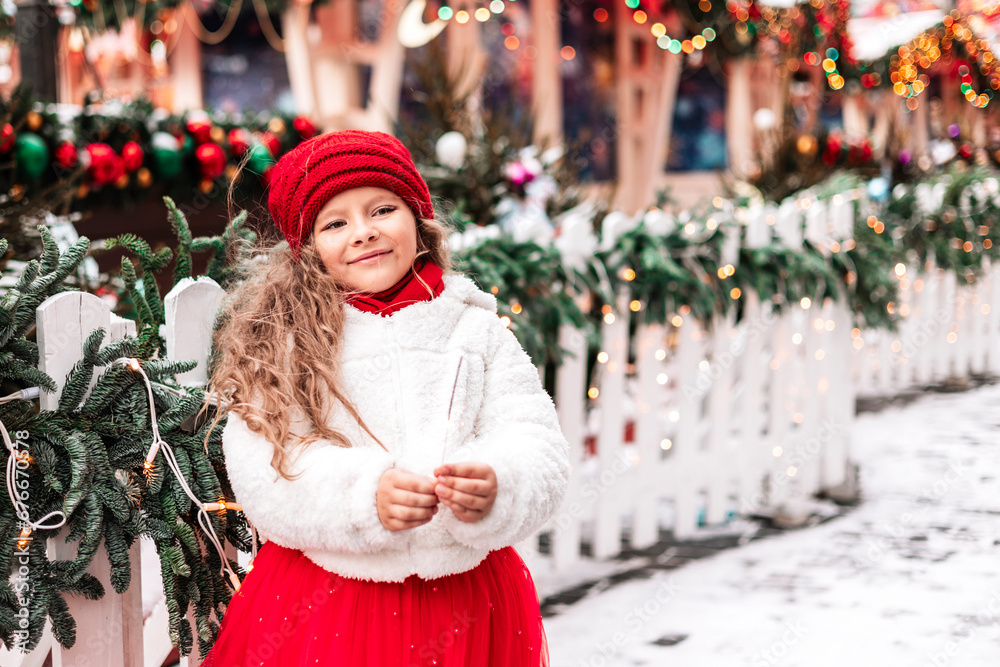 girl in a white fur coat and a red hat and skirt next to Christmas Tree have fun on Red Square in Moscow during the Christmas and New Year holidays at a festive fair, Gifts for Christmas and New Year girl in a white fur coat and a red hat and skirt next to Christmas Tree have fun on Red Square in Moscow during the Christmas and New Year holidays at a festive fair, Gifts for Christmas and New Year