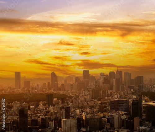 Cityscape of skyline of tokyo city with gold light sun set /sun rise sky background in winter season, Tokyo, Japan