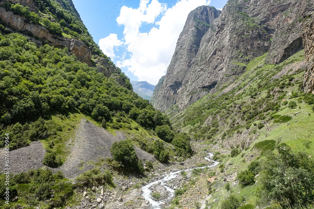 The picturesque gorge of the Jylgy-su river. The Caucasus Mountains near the ancient city of Eltuby. Next to the grotto with an ancient human parking lot.