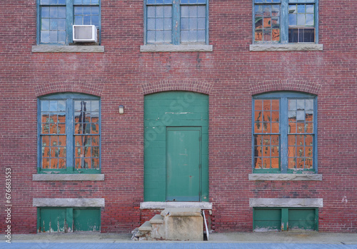 facade view of old factory building with red brick wall