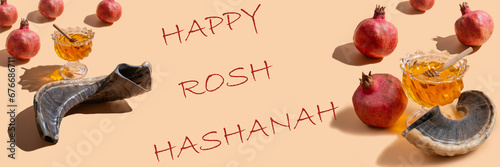 Jewish holiday Rosh Hashanah banner. Greeting card with Fresh honey, musical horn Shofar, pomegranate seeds and inscription Happy Rosh Hashanah on beige background.