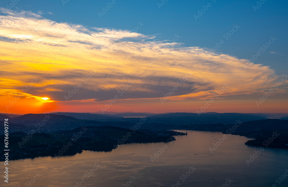 Fototapeta premium Aerial View over Lake Lucerne and Mountain in Sunset in Lucerne, Switzerland.