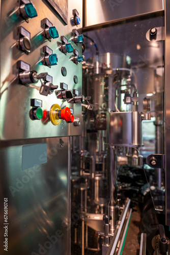 Automated Wine Bottling on Conveyor Belt in Factory in Switzerland. © Mats Silvan