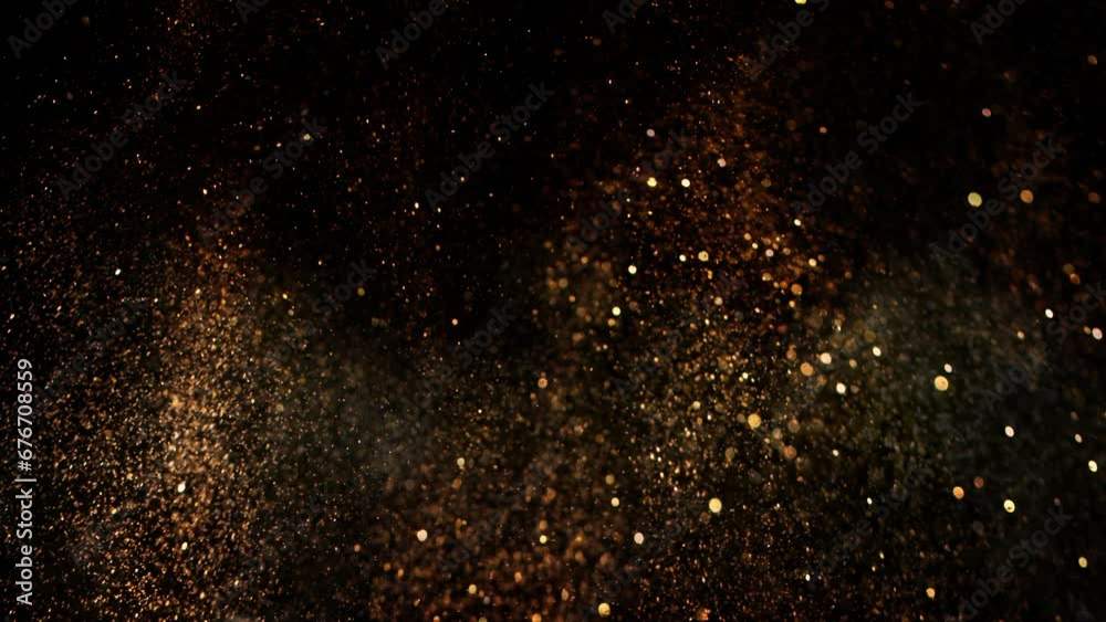 Super Slow Motion Shot of Festive Golden Glittering Background at 1000fps.