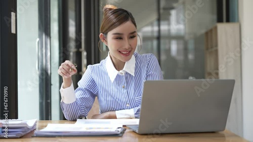 Marketing expert, smart Asian businesswoman working on laptop computer and financial documents in business office, project manager, business concept, money, 4K