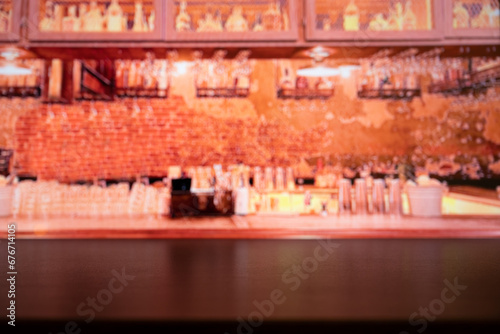 Wooden table on blur of cafe image  coffee shop  bar  background - can used for display or montage your products