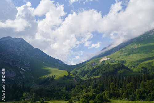 Great landscape with a green mountain pass, forests and meadows.