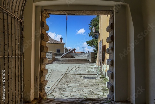 View through a gate to the round bastion of the ancient Croatian town of Labin