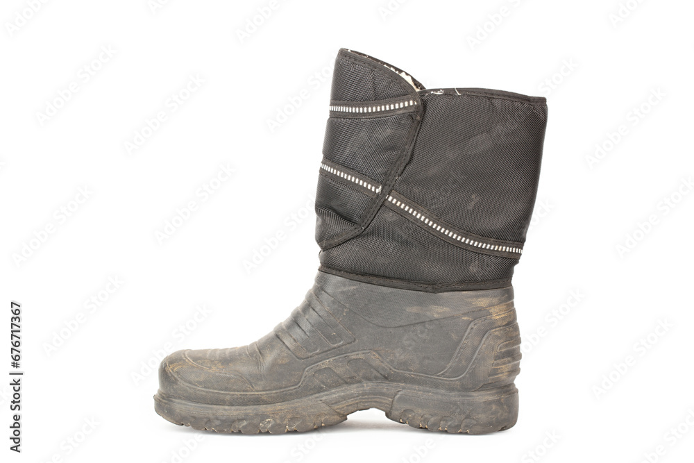 One dirty male rubber boot. isolated on white background. autumn rain protection shoes. One dirty male rubber boot. isolated on white background. autumn rain protection shoes.