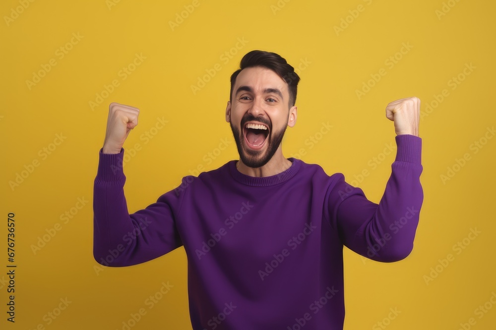 A young bearded man standing against a yellow background rejoicing in success and victory, clenching his fists in joy and happy to achieve his goal and tasks. Positive emotions. generative AI A young bearded man standing against a yellow background rejoicing in success and victory, clenching his fists in joy and happy to achieve his goal and tasks. Positive emotions. generative AI