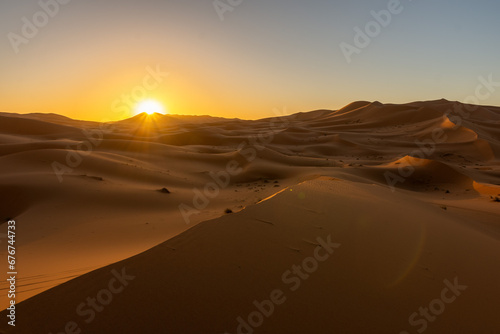 Moment when the first rays of sun appear in the Mezouga desert.