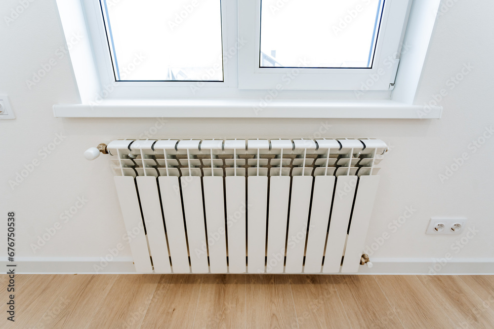 custom made wallpaper toronto digitalThe heating radiator hangs in the room under the window, the heating system in the house, the heating of cold air from the window.