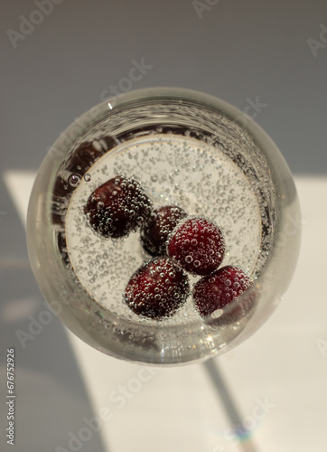 Cherry in a glass of sparkling water