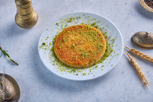 Turkish künefe dessert plate with pistachio photo