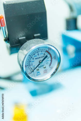 Pressure Gauge, pressure gauge on a gas regulator in a laboratory analytical equipment.