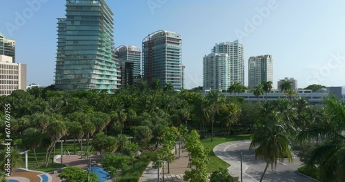 Concrete and glass skyscraper buildings in Coconut Grove neighborhood of Miami in Florida, USA. Upscale American downtown with business financial district on sunny day photo