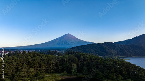 Aerial view of forest with Mount Fujisan in the background, summer evening in Japan