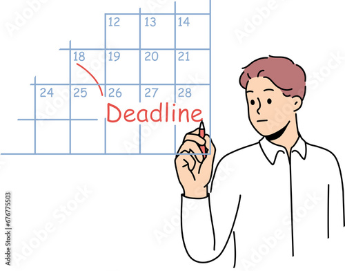 Business man fills in calendar and makes note of deadlines so as not to miss day of reporting