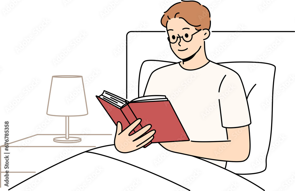 Man reads book before bedtime, sitting in bed at night and enjoying plot of fantasy novel Man reads book before bedtime, sitting in bed at night and enjoying plot of fantasy novel