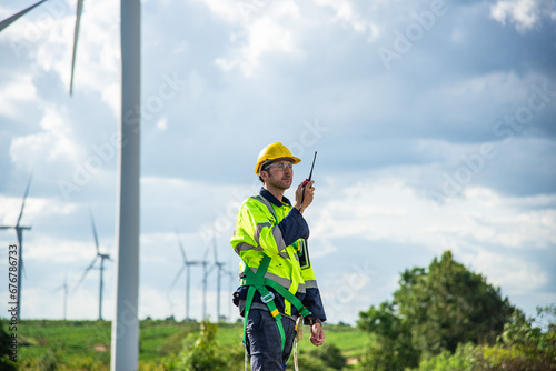 Wind turbine Engineer working in wind turbine farm , Generator station, renewable energy , Sustainable energy industry concept