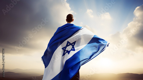 man with israel flag over bright sky background photo