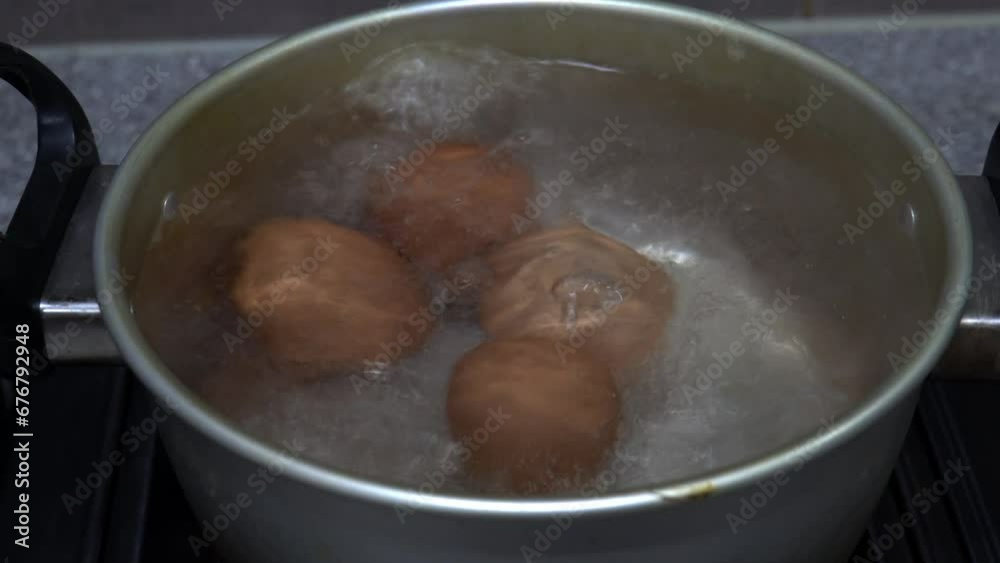 eggs boiling in a pan