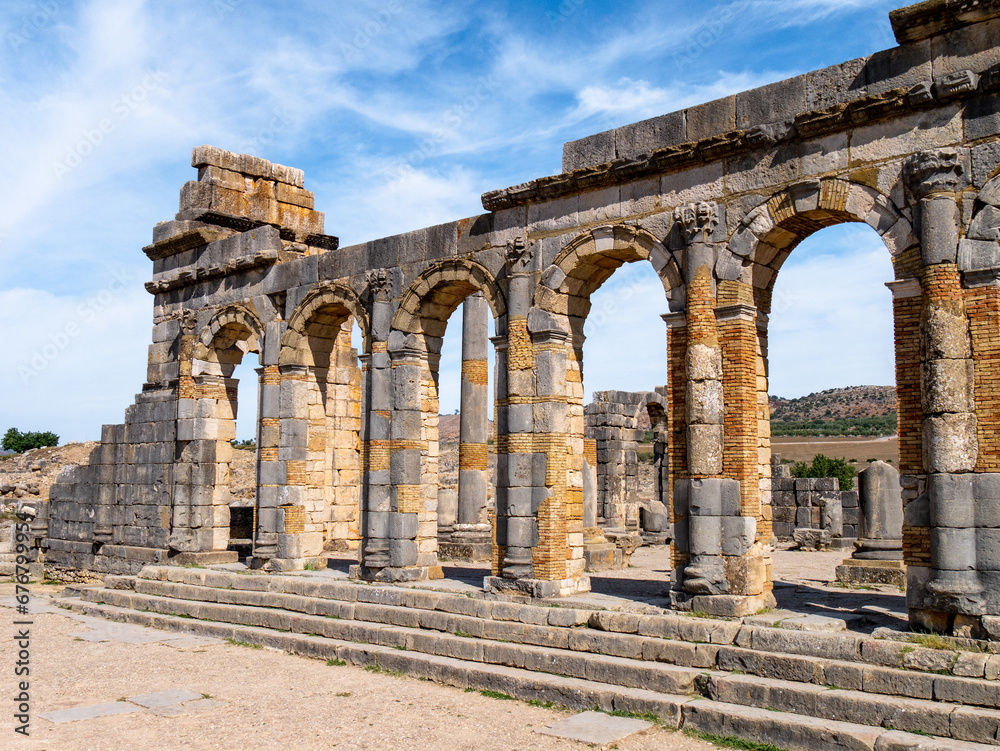 Ancient Roman Ruins of Volubilis in Walili, Morocco on a sunny afternoon