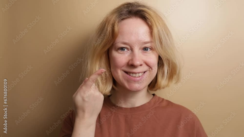 woman holding soft contact lens on the finger, Optic health, Clear eyesight, Ophthalmic correction, banner, beige background woman holding soft contact lens on the finger, Optic health, Clear eyesight, Ophthalmic correction, banner, beige background