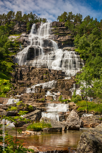 Tvindefossen is a waterfall  located about 12 kilometres north of the village of Vossevangen along the European route E16 road to Flåm.