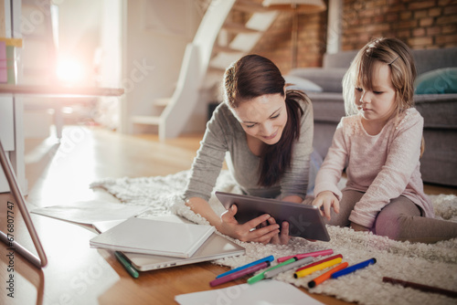 Mother and Daughter Enjoying Drawing Together at Home