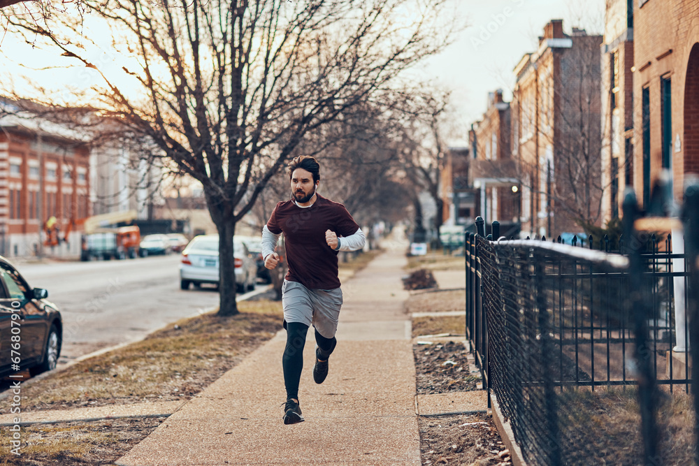 Determined Man Jogging through the City Streets