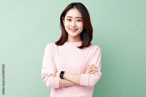 photo portrait of young asia lady with positive expression, arms crossed, smile broadly, dressed in casual clothing, generative ai © Nia™
