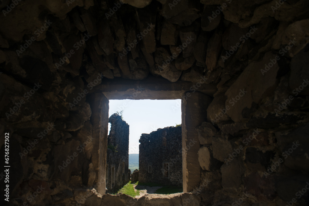 window into the courtyard of an abandoned castle