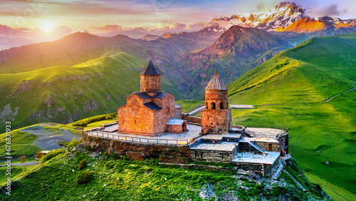 Aerial view of Gergeti trinity church at sunrise in Georgia.
