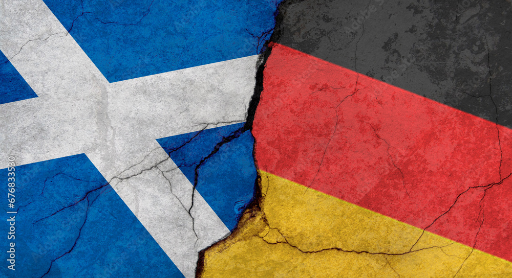 Scotland and Germany flags, concrete wall texture with cracks, grunge background, military conflict concept