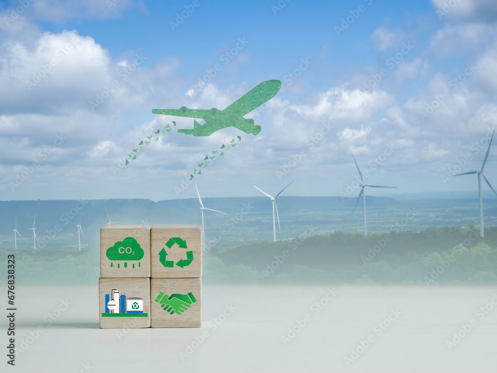 Φωτογραφία Ideas for reducing carbon emissions in airplanes Use SAF sustainable aviation fuel for a greener future with low CO2 icons on a wooden block background with wind turbines