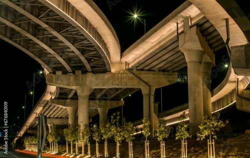 Low angle under trails on the bridge expressway road at night