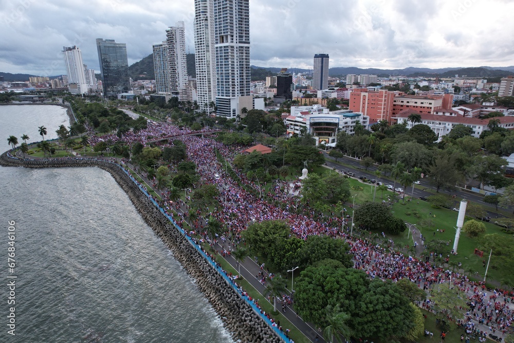 Fototapeta premium Aerial views from over the protesters on Avenida Balboa protesting against the First Quantum Copper mining contract, downtown Panama City, Panama