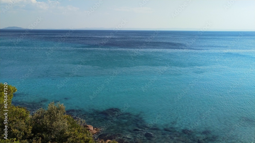 Scenic shot of a vast turquoise sea water across the horizon