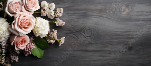 Beautiful flower bouquet on the dark wooden background. AI generated image © orendesain99