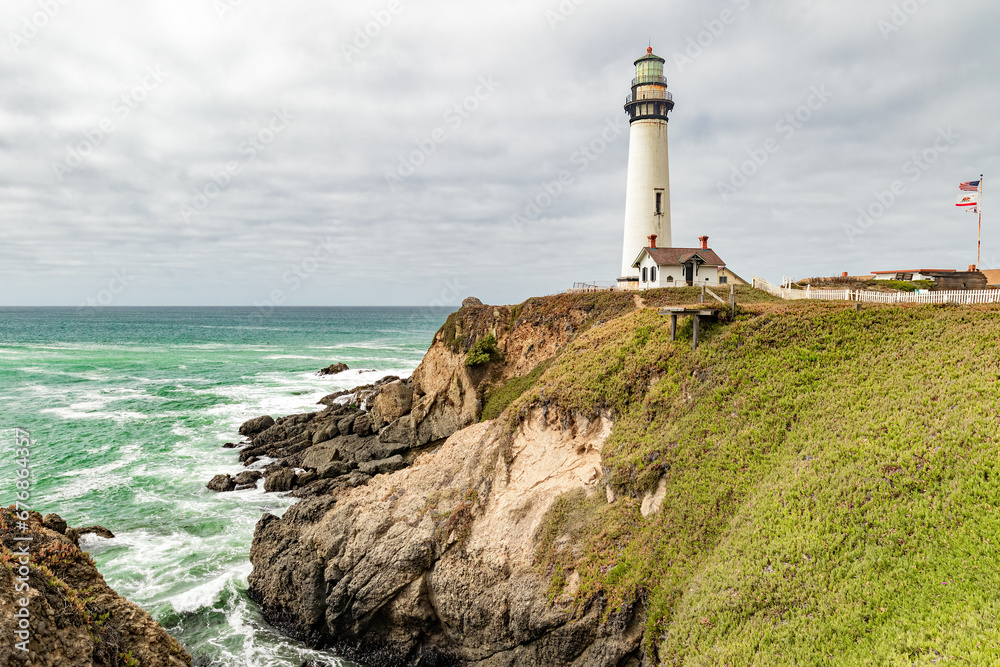 Lighthouse on the central Oregon coast with storm clouds in the background Lighthouse on the central Oregon coast with storm clouds in the background