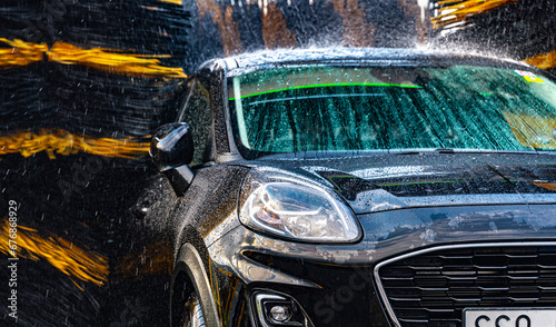 A vehicle in an automatic car wash