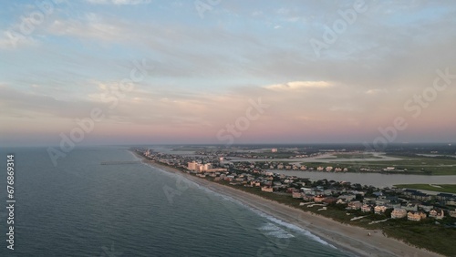 Aerial view of the sea beach under a blue sky © Wirestock