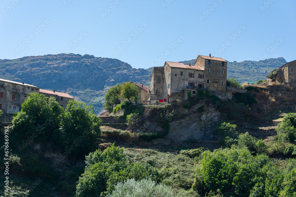 Houses built on cliff in Corsica