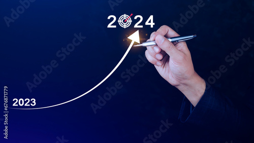2024 Business Planning, Strategy, creative, Idea concept, Businessman pointing chart graph with 2024 business icon, new setting goal, objective, target, goal, new year's resolution, business marketing